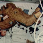Pilot Fullerton dons anti-g and ejection escape suit (EES) on middeck