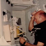 Pilot Fullerton uses hairbrush at the WMC door mirror on middeck