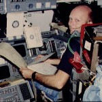 Pilot Fullerton reviews FDF and TAGS printout on forward flight deck