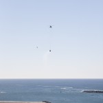 An Erickson Sky Crane helicopter returns the SpaceX Dragon test article to Morro Bay, Cailf., following a drop test to evaluate the spacecraft's parachute deployment system. Image Credit: NASA/Kim Shiflett