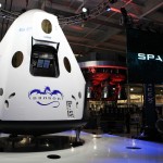 The Dragon V2 stands on a stage inside SpaceX headquarters in Hawthorne, Calif., prior to its unveiling. The spacecraft is designed to carry people into Earth's orbit and was developed in partnership with NASA's Commercial Crew Program under the Commercial Crew Integrated Capability agreement. SpaceX is one of NASA's commercial partners working to develop a new generation of U.S. spacecraft and rockets capable of transporting humans to and from Earth's orbit from American soil. Ultimately, NASA intends to use such commercial systems to fly U.S. astronauts to and from the International Space Station. Photo credit: NASA/Dimitri Gerondidakis
