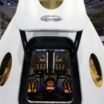 A look through the open hatch of the Dragon V2 reveals the layout and interior of the seven-crew capacity spacecraft. SpaceX unveiled the new spacecraft during a ceremony at its headquarters in Hawthorne, Calif. The Dragon V2 is designed to carry people into Earth's orbit and was developed in partnership with NASA's Commercial Crew Program under the Commercial Crew Integrated Capability agreement. SpaceX is one of NASA's commercial partners working to develop a new generation of U.S. spacecraft and rockets capable of transporting humans to and from Earth's orbit from American soil. Ultimately, NASA intends to use such commercial systems to fly U.S. astronauts to and from the International Space Station. Photo credit: NASA/Dimitri Gerondidakis