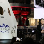 SpaceX CEO and founder Elon Musk discusses the Dragon V2 during an unveiling ceremony for the new spacecraft inside SpaceX headquarters in Hawthorne, Calif. The spacecraft is designed to carry people into Earth's orbit and was developed in partnership with NASA's Commercial Crew Program under the Commercial Crew Integrated Capability agreement. SpaceX is one of NASA's commercial partners working to develop a new generation of U.S. spacecraft and rockets capable of transporting humans to and from Earth's orbit from American soil. Ultimately, NASA intends to use such commercial systems to fly U.S. astronauts to and from the International Space Station. Photo credit: NASA/Dimitri Gerondidakis